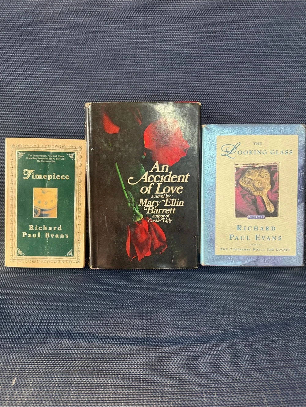 Set of Three Decorative Vintage Book Covers Featuring Red, Black & Blue Accents